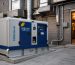 **Alt text:** Enpower diesel generator installed outside a commercial kitchen with ventilation ducts and an open service entrance.